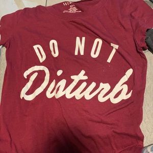 Red shirt says do not disturb